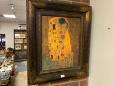 A framed reproduction Klimt print