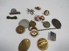 A collection of medals and badges some of military interest including a Ghurka badge