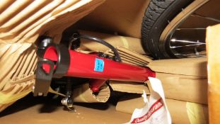 A boxed red Challenge VXT hybrid bike with steel frame, 18 speed, 28