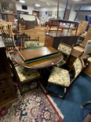 A quality oak extending dining table with four chairs