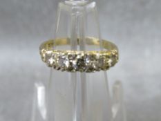 An 18ct gold five stone diamond ring, ring size O, approximate weight 3.5 g