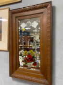 A vintage oak framed etched and painted mirror