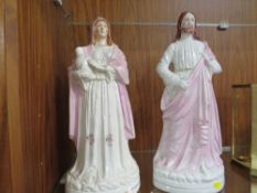 A pair of large Staffordshire flatback style religious figurines