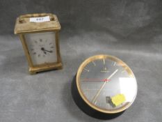 An Omega cast metal desk clock together with a carriage clock (2)