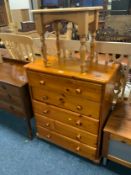 A honey pine five drawer chest together with a pine occasional table. (2)