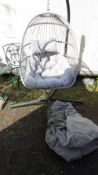 An outdoor garden hanging egg chair