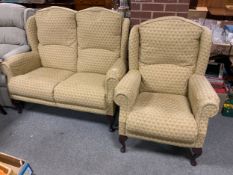 A modern two piece suite comprising a two seater sofa and an armchair