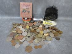 A tub of mainly British coins, to include Isle of Man 50 pence's, Lloyds Bank money box etc.