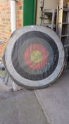 A large straw backed archery target