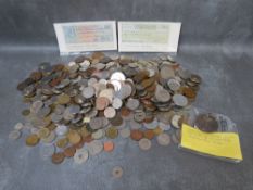 A tub of mainly world coins, to include Swiss francs etc. and minor Italian notes