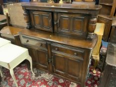 A reproduction oak court cupboard