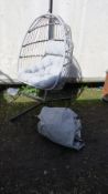 An outdoor garden hanging egg chair