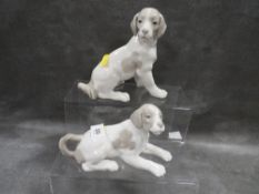 Two Nao dog figurines