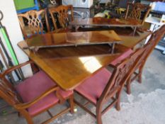 A high gloss large dining set with cross band detail. two extension pieces and six chairs, L 163