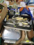 A tray of assorted metal ware to include a shoebox of flatware