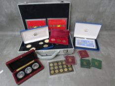 An Aluminium collectors case of assorted coins in various cases and boxes, to include pre decimal