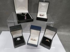 Three silver rings, silver necklace, silver earrings