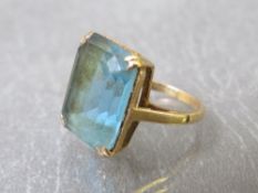 A 9ct gold dress ring set with a large blue rectangular stone, ring size N, approximate weight 6.7