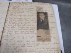 A WW2 (dated 1943) RAF scrapbook, filled with handwritten detail, newspaper and magazine