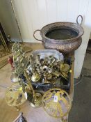 A quantity of assorted brass ware to include trivets, candlesticks etc together with a large