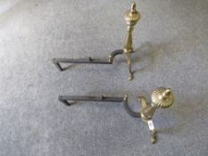 A pair of antique fire dogs