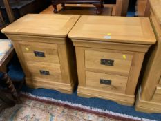 A quality pair of light oak bedside chests