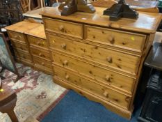 A honey pine chest of five drawers together with two bedside chests