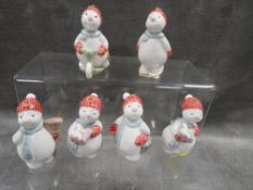A collection of six miniature Nao snowman figures