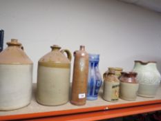 A quantity of assorted stoneware bottles etc