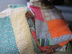 A selection of vintage luggage and assorted textiles