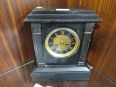 A vintage slate mantle clock
