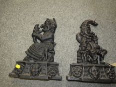 A pair of Punch & Judy cast iron doorstops