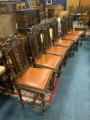 A set of six oak Jacobean style dining chairs