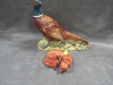 A Beswick model of a pheasant together with a Beswick curled fox A/F