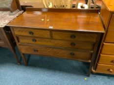 An antique mahogany four drawer chest of drawers