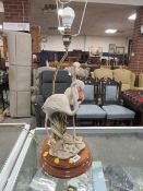 A novelty style lamp modelled as a pair of flamingos