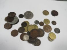 A bag of coins, tokens, and medals including a US dollar