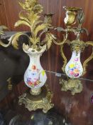 A pair of ceramic and gilt metal twin branch candelabra A/F