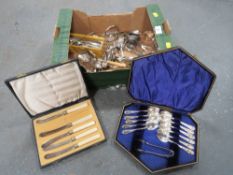 A tray of silver plated flatware, bowls etc.