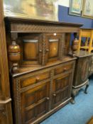 A reproduction oak court cupboard