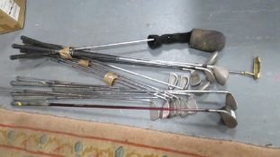 A selection of golf clubs to include Ping Eye, Titleist etc