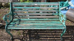 A three seater garden bench with a cast iron frame