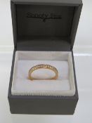 A rose gold plated sterling silver ring set with small diamonds, size P