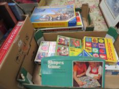 Three trays of assorted vintage puzzles