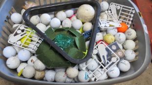 A basket of golf balls etc