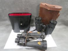 A cased military pair of Barr & Stroud 7 x CF41 binoculars together with a pair of Optomax examples