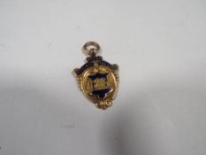 A hallmarked 9 carat gold and enamel Welsh National Football League - league cup winners medal