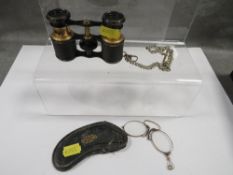 A vintage pair of opera glasses together with cased pince nez glasses and a watch chain (3)