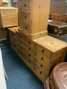 A colonial eight drawer multi chest together with a pair of bedside chests