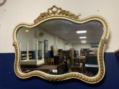 A cream and gilt vintage wall mirror
